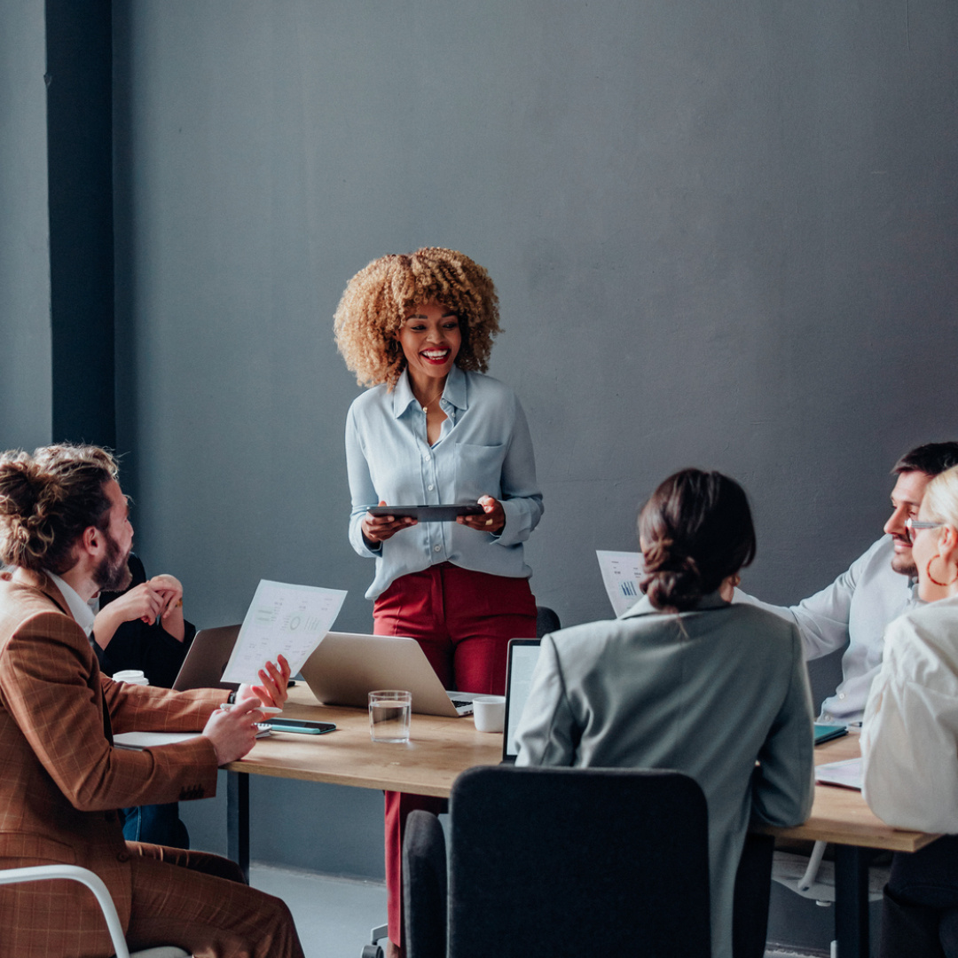 Woman in meeting with colleagues 