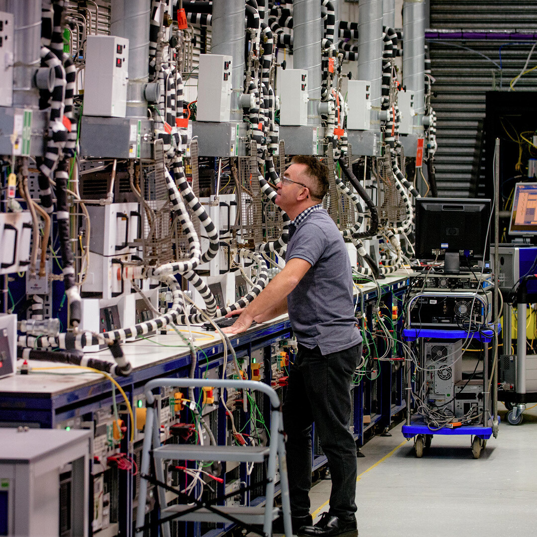 A man standing within an Engineering environment